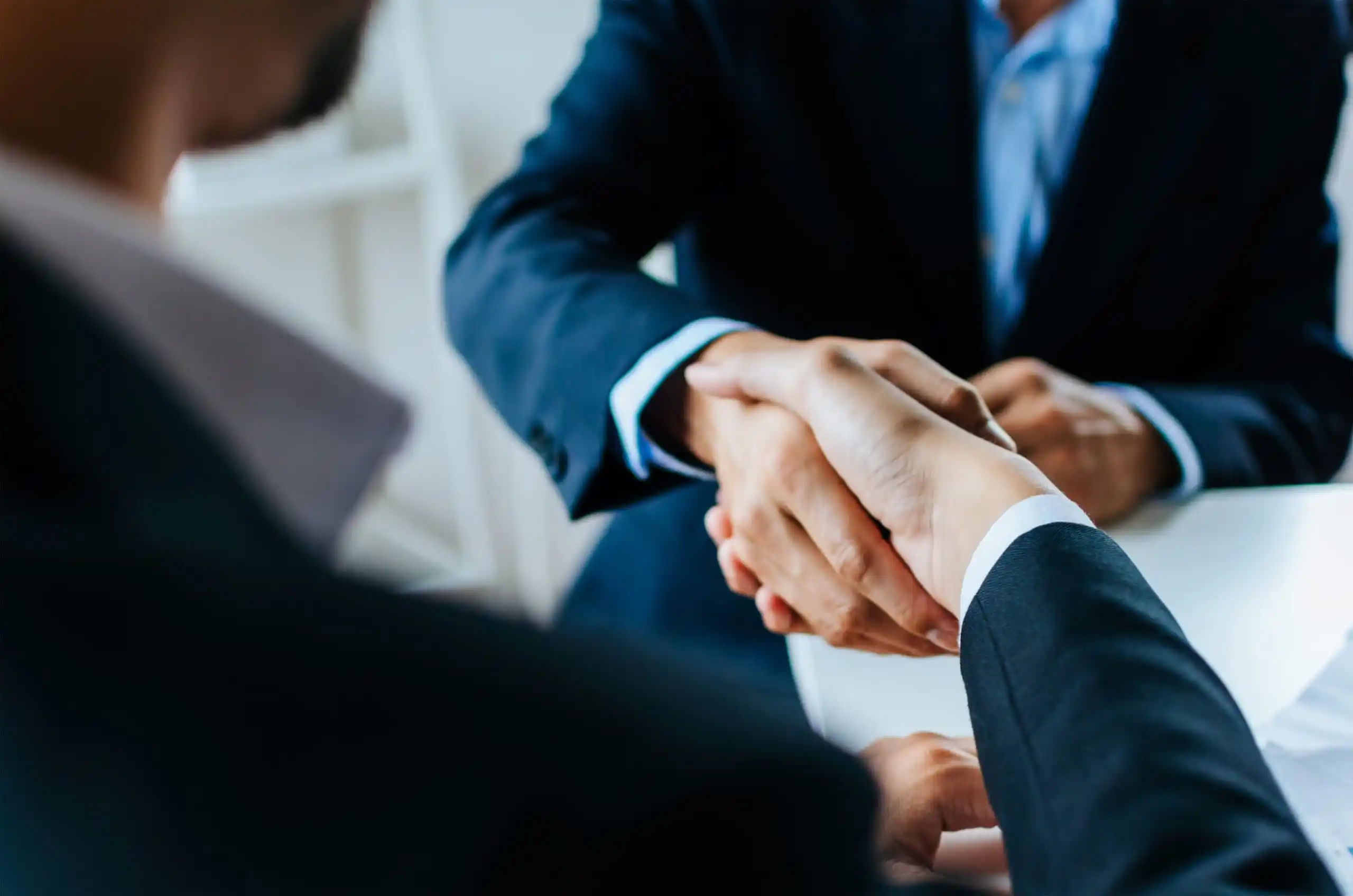 men of color business agreement handshake