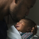 Getty Image of men of color in fatherhood.